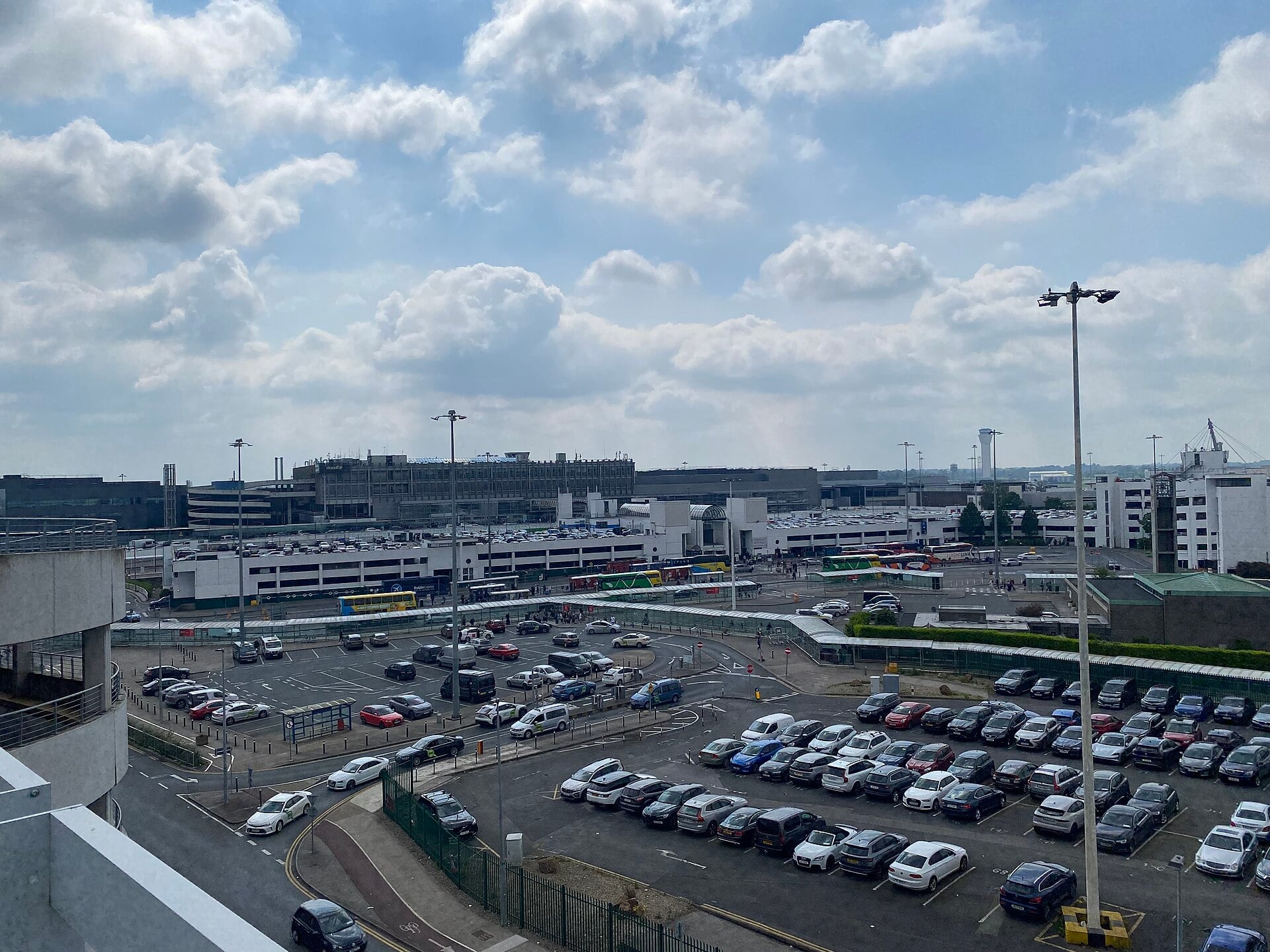 Exterior of Dublin Airport Terminal 1 with the bus and taxi pick-up area and car park in view