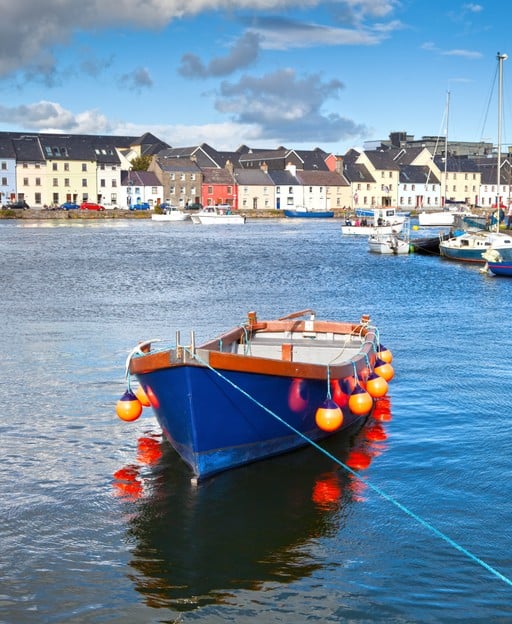 Galway Harbour with colourful townhouses and moored boats, Ireland