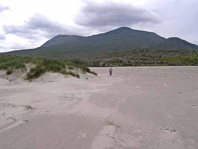Sandy beach and dunes at Silver Strand, County Mayo, with Mweelrea mountain in the background