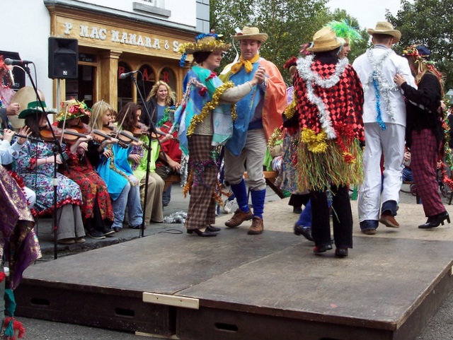 Wren Boys in traditional straw hats and disguise costumes at Bunratty Castle &mdash; Ireland's related straw-costume mumming tradition