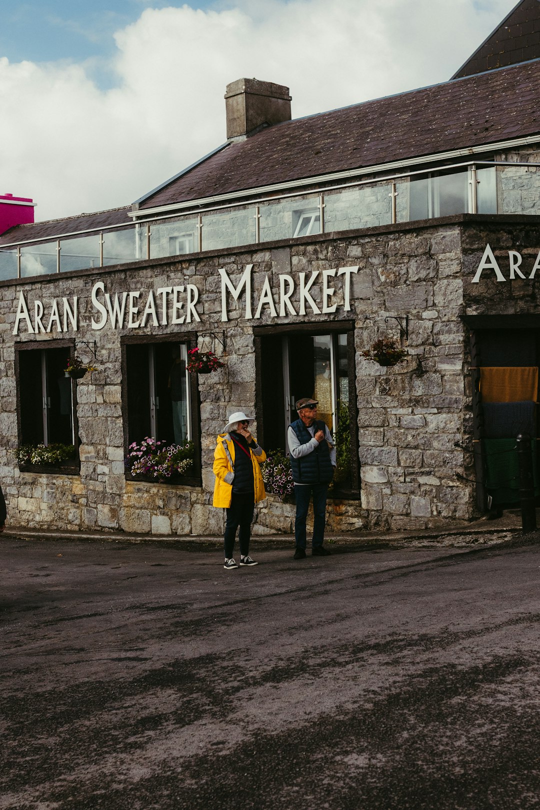 Two visitors outside the Aran Sweater Market in Ireland
