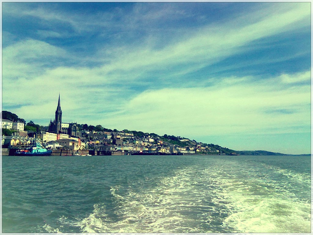 View of Cobh harbour with St Colman's Cathedral spire rising above the waterfront, County Cork