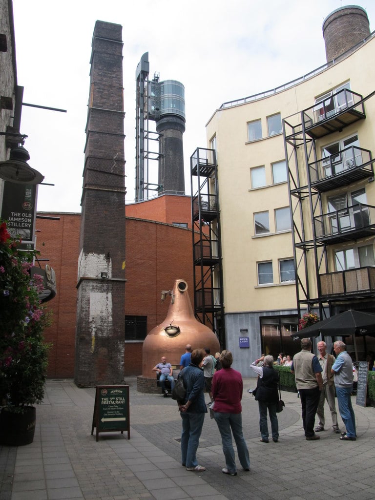 Copper pot still and 19th-century chimney stack at the Old Jameson Distillery on Bow Street, Dublin