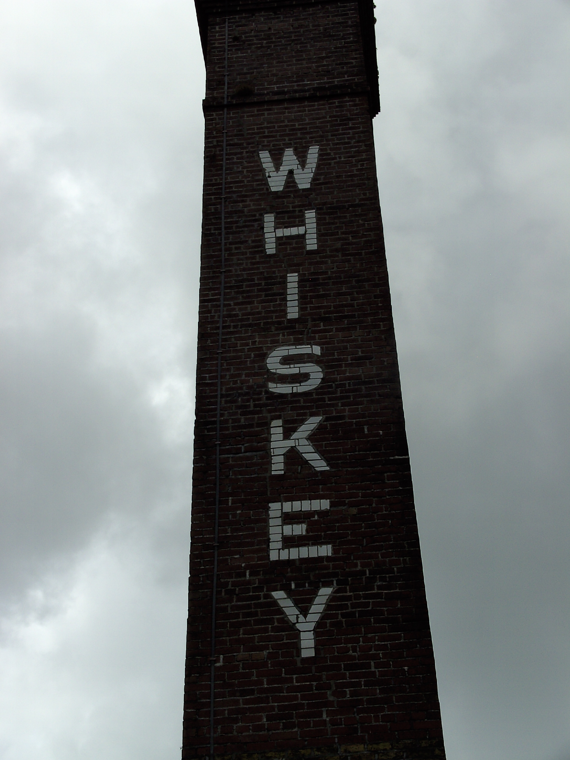 The 1880s brick chimney stack at Kilbeggan Distillery, County Westmeath, painted with the word Whiskey