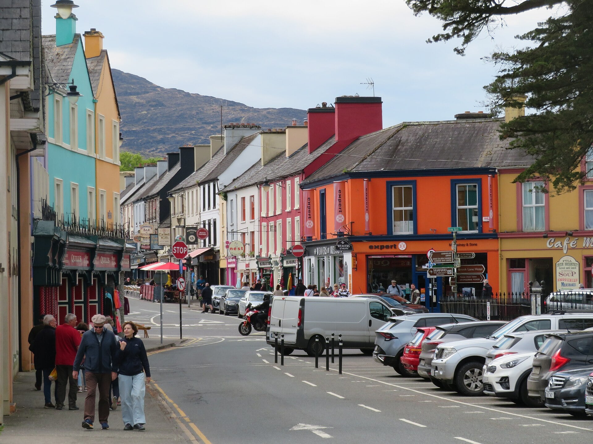 Colourful shopfronts lining the main street of a Ring of Kerry village