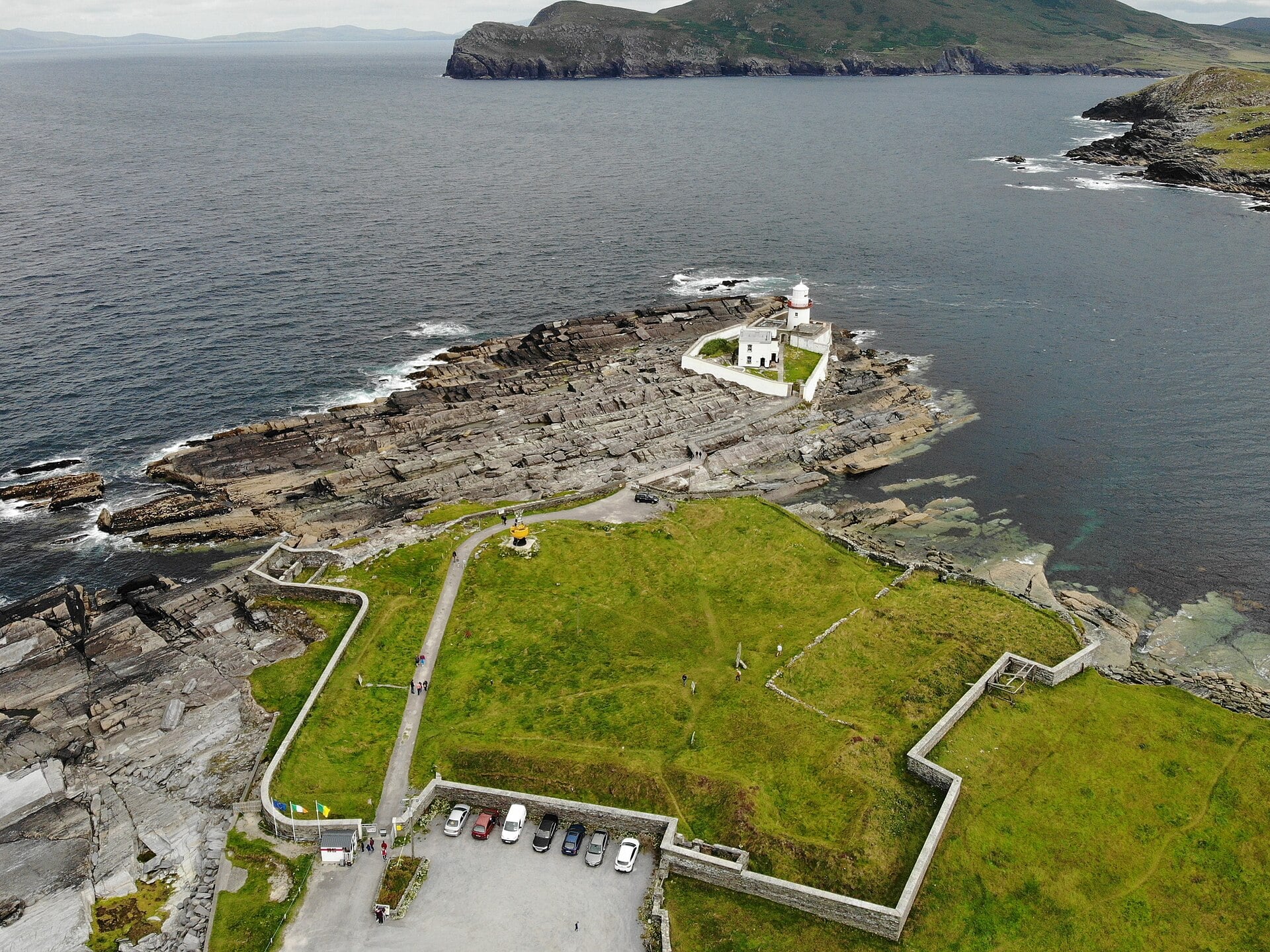 Aerial view of a lighthouse on the rocky headland at Valentia Island
