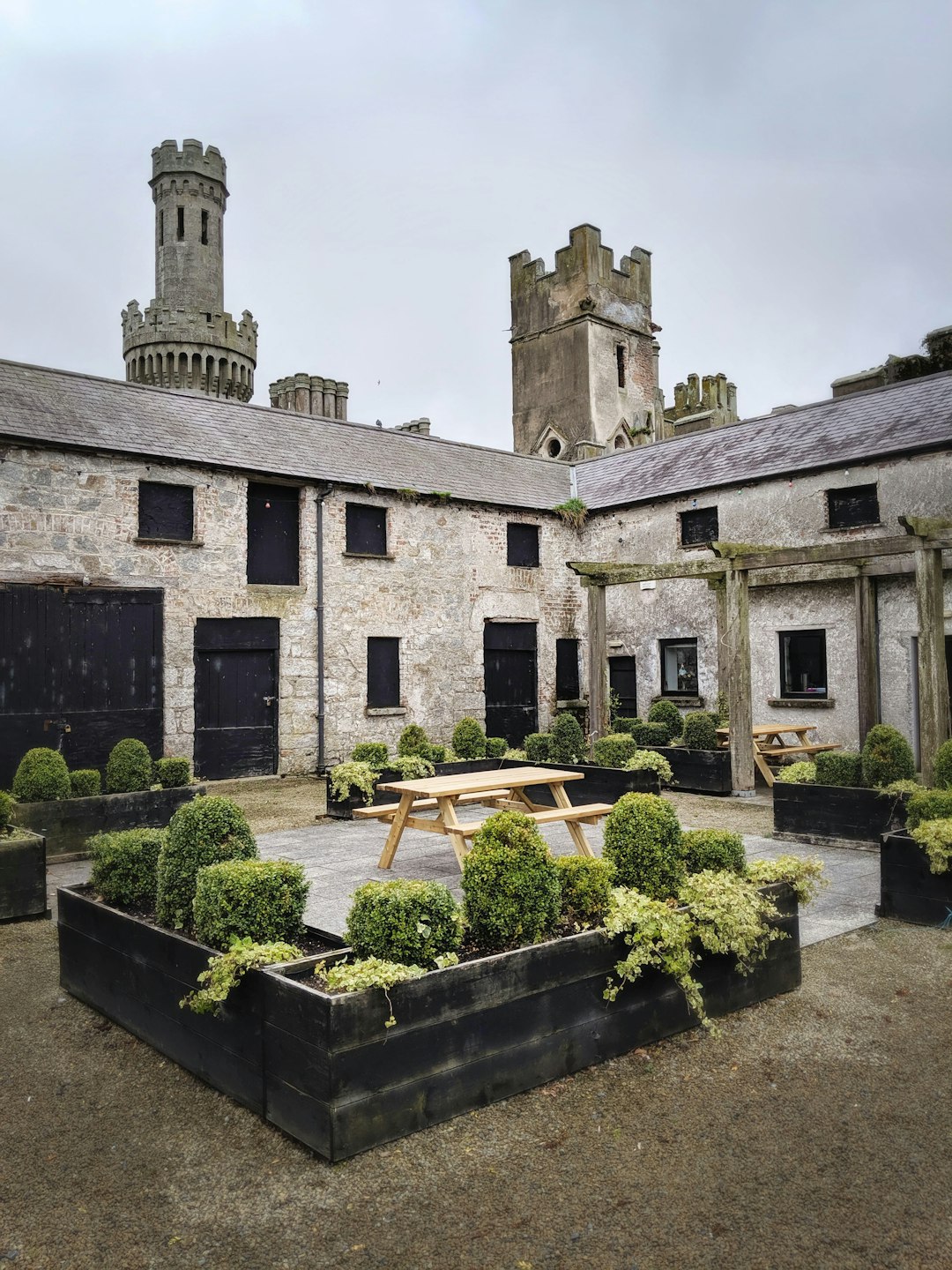 Restored stone stable-yard courtyard, now used as event and garden space