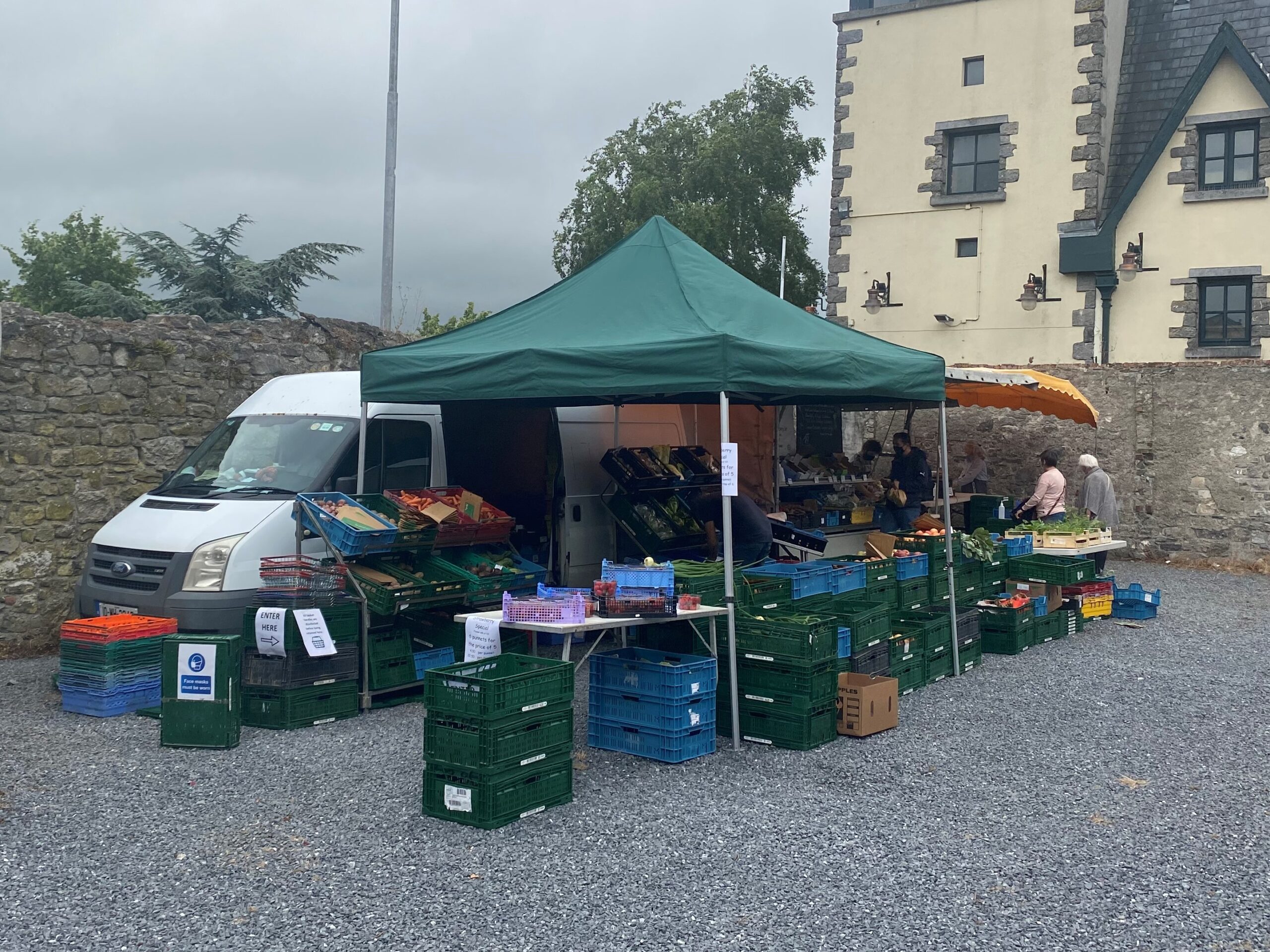 Fresh vegetables and fruit at an outdoor farmers market stall in Carlow, Ireland