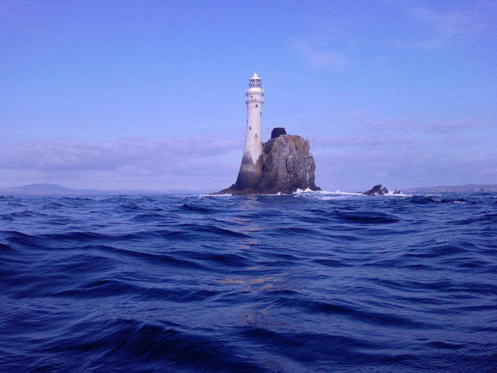 Fastnet Rock Lighthouse, the automated white tower standing alone on its rock south-west of Cape Clear Island off the West Cork coast