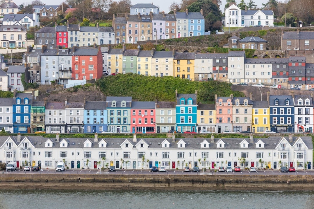Colourful row houses along the harbour in a picturesque Irish coastal town, a popular retirement destination