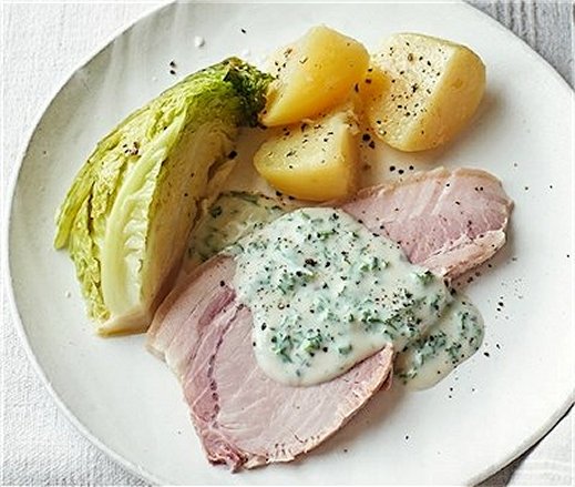 Traditional Irish bacon and cabbage with potatoes and parsley sauce