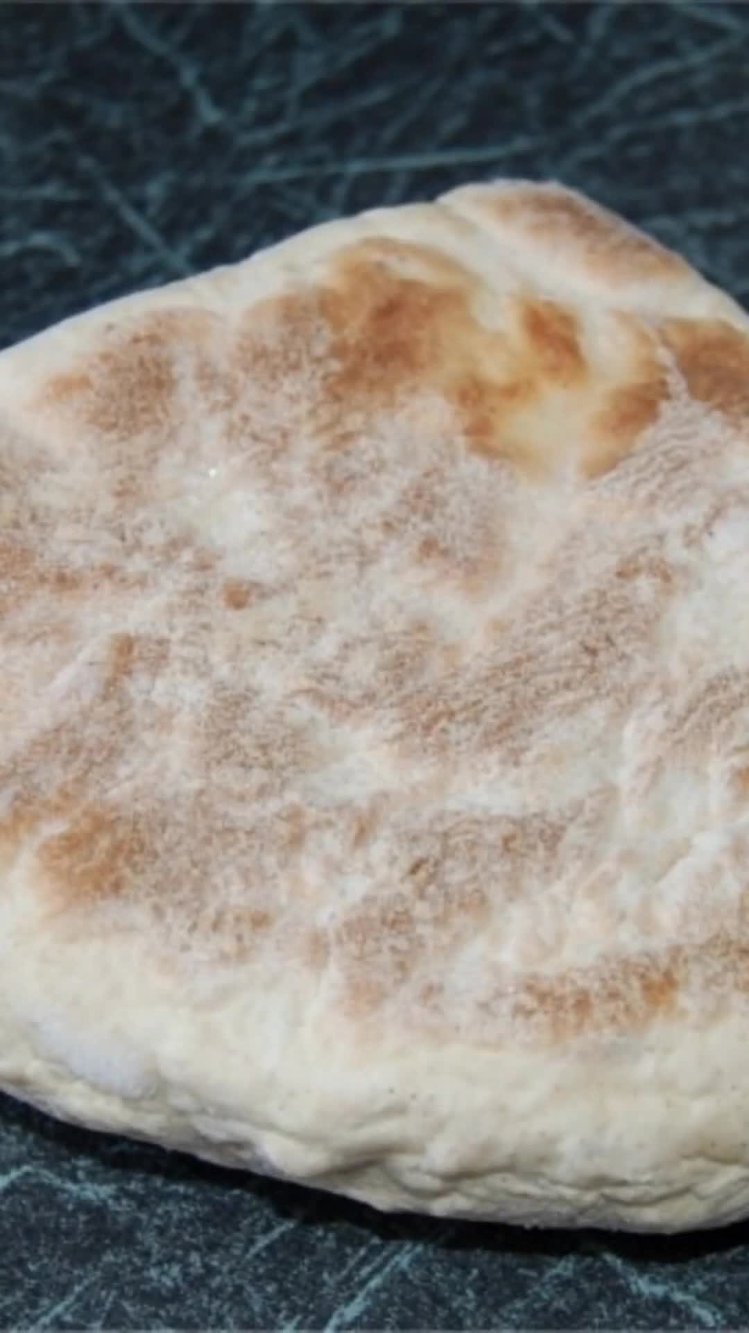 Close-up of a freshly griddled Irish flatbread with toasted brown spots, from the Love Irish Cooking video series