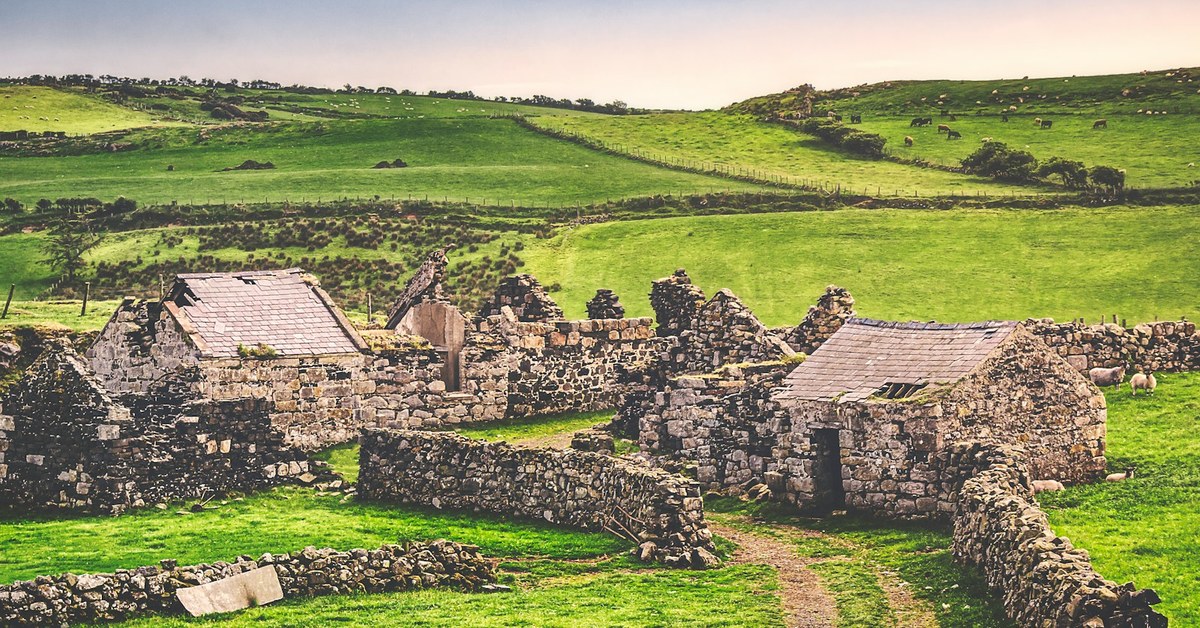 Ancient stone wall with historic carvings in Northern Ireland, representing the Red Hand of Ulster legend