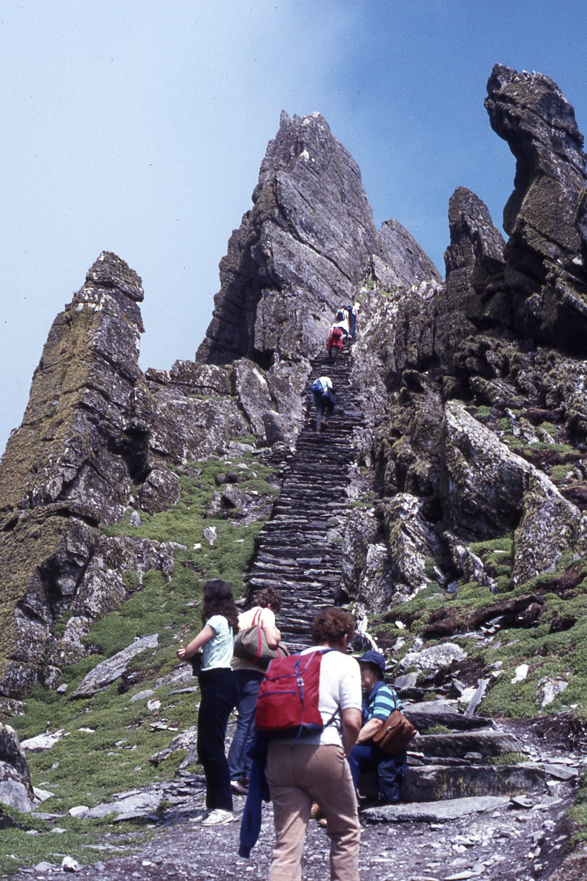 Visitors climbing the ancient stone steps toward the monastery on Skellig Michael, County Kerry