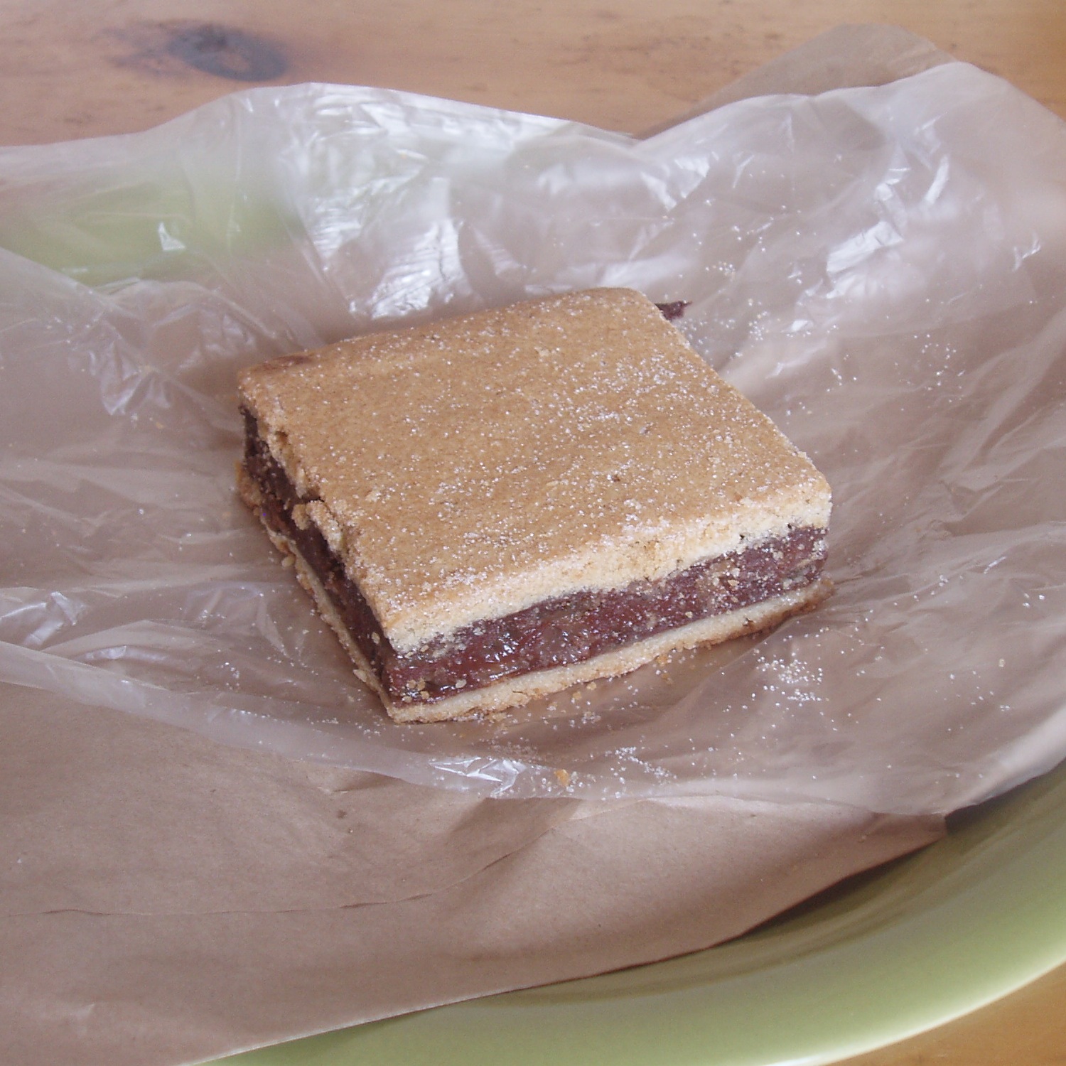 Traditional Dublin Gur Cake slice, with spiced fruit filling sandwiched between two layers of shortcrust pastry and a light dusting of sugar