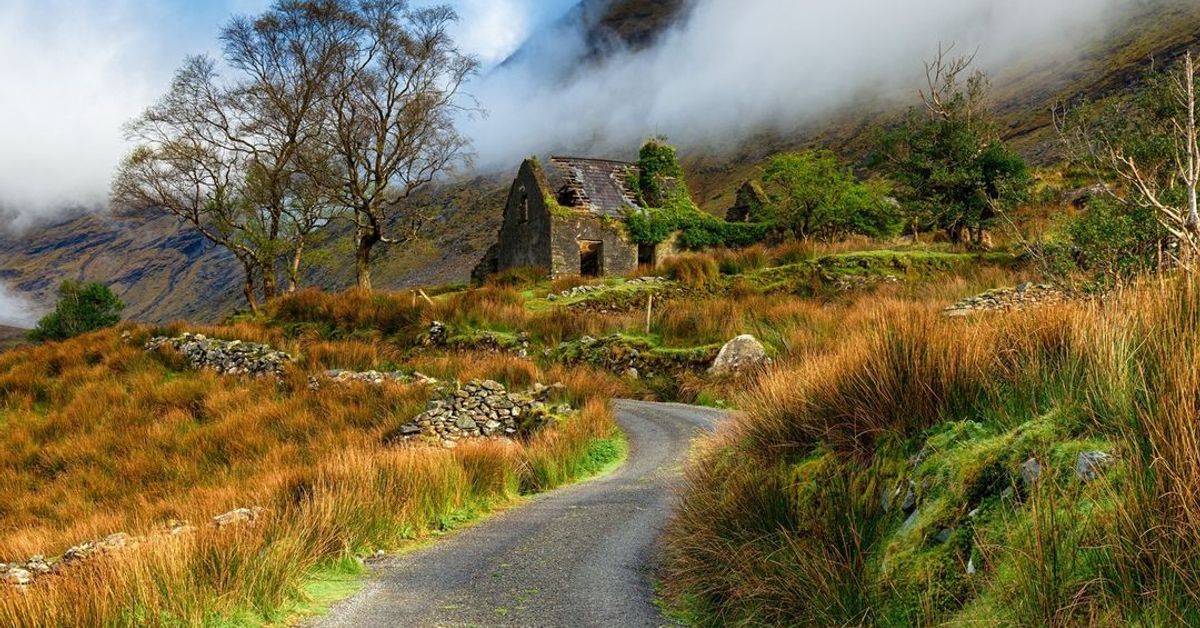 Ruined Irish stone cottage in mountain valley, County Kerry, Ireland