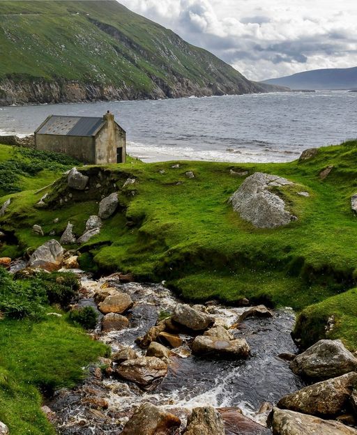 Keem Bay, Achill Island, County Mayo, Ireland — rugged west coast coastline with traditional stone building