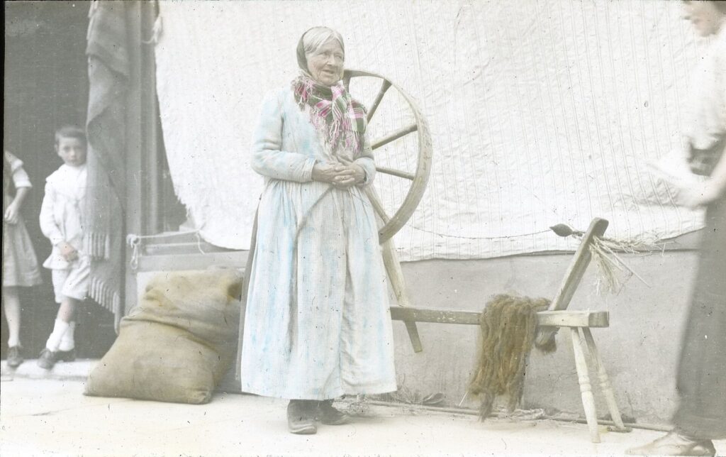 A wool spinner at her wheel in Kenmare, County Kerry (historic photograph)