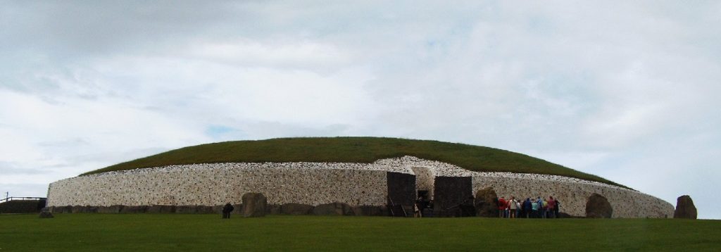 The white quartz facade and entrance of the Newgrange passage tomb at Brú na Bóinne, County Meath