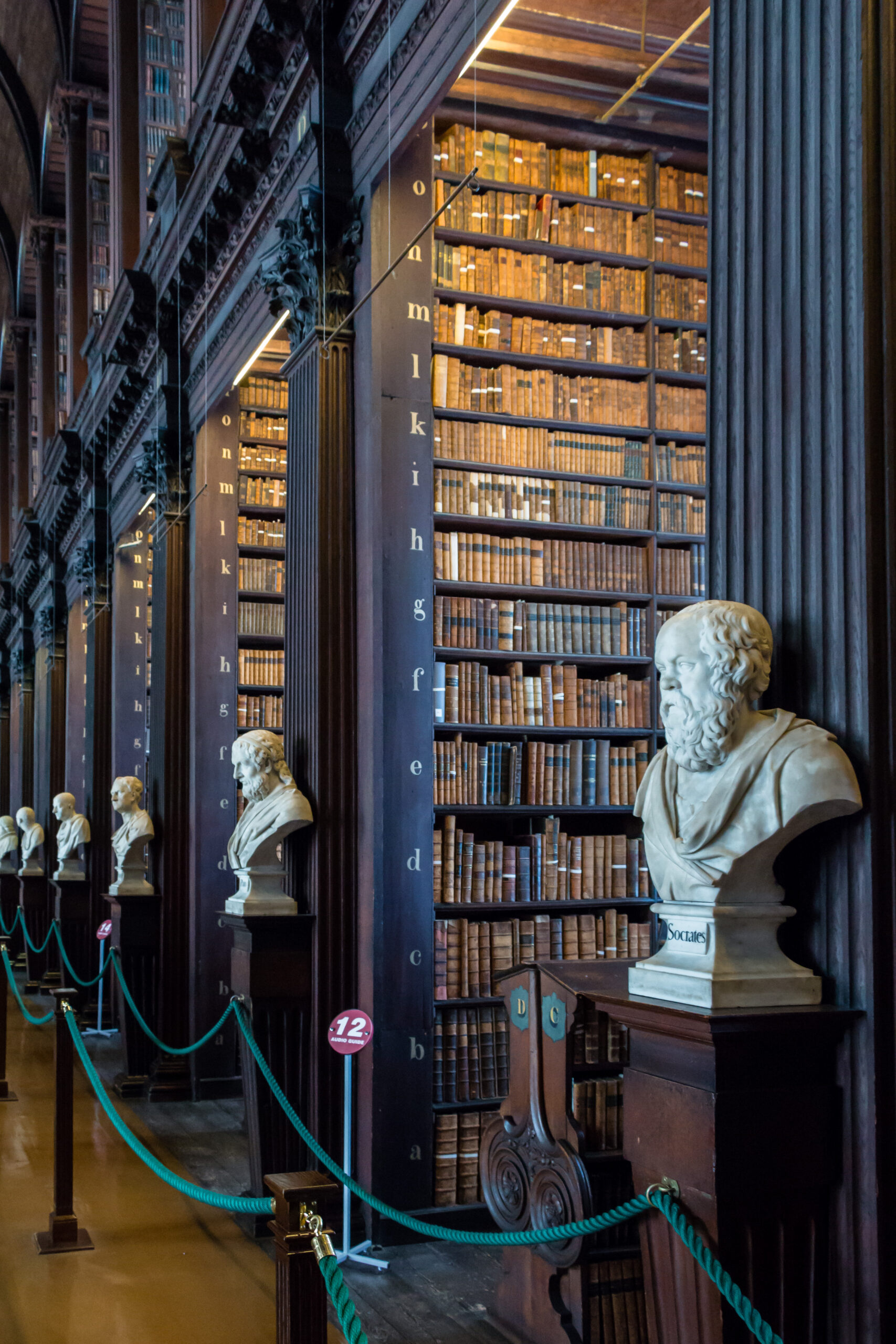 The Long Room at Trinity College Dublin, lined with centuries-old book-filled shelves and marble busts of scholars