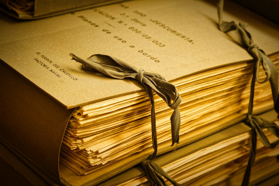 Vintage archive documents tied with ribbon in a historical records room — representing the kind of handwritten household returns held in the 1926 Irish Census at the National Archives of Ireland. Photo: Eric Prouzet / Unsplash