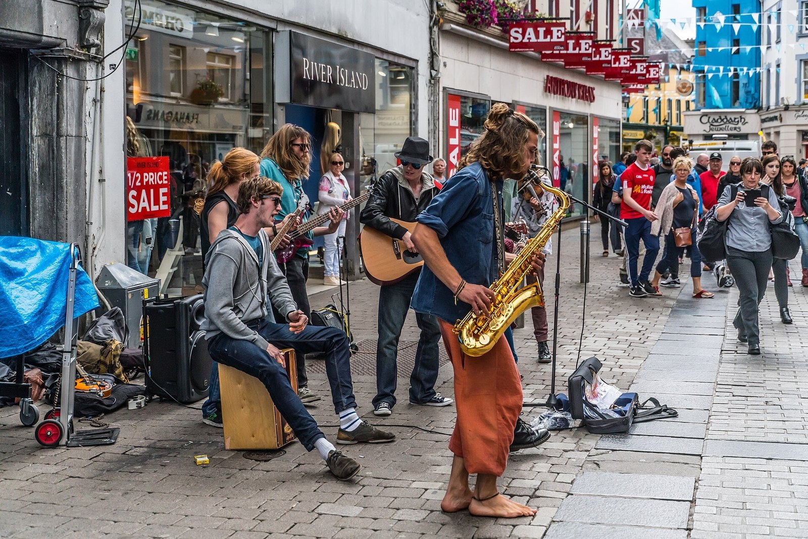 Street musicians playing on Shop Street in Galway